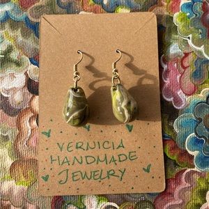 Green, black, and white handmade earrings